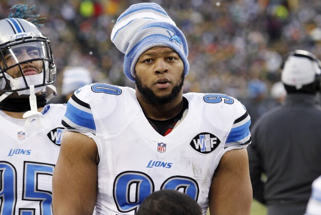 FILE - This Dec. 28, 2014 photo shows Detroit Lions' Ndamukong Suh looking on during the first half of an NFL football game against the Green Bay Packers in Green Bay, Wis. The league announced Monday, Dec. 29, 2014 that Suh was suspended for stepping on Packers quarterback Aaron Rodgers' left leg twice, once with each foot. Suh also applied pressure and pushed off Rodgers' unprotected leg with his left foot, violating unnecessary roughness rules, the league said in a statement. He will miss Sunday's wild-card playoff game against Dallas. (AP Photo/Matt Ludtke, file) FILE - This Dec. 28, 2014 photo shows Detroit Lions' Ndamukong Suh looking on during the first half of an NFL football game against the Green Bay Packers in Green Bay, Wis. The league announced Monday, Dec. 29, 2014 that Suh was suspended for stepping on Packers quarterback Aaron Rodgers' left leg twice, once with each foot. Suh also applied pressure and pushed off Rodgers' unprotected leg with his left foot, violating unnecessary roughness rules, the league said in a statement. He will miss Sunday's wild-card playoff game against Dallas. (AP Photo/Matt Ludtke, file)