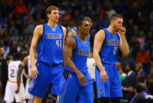 Dec 23, 2014; Phoenix, AZ, USA; Dallas Mavericks guard Rajon Rondo (9), forward Dirk Nowitzki (41)and forward Chandler Parsons (25) against the Phoenix Suns at US Airways Center. The Suns defeated the Mavericks 124-115. Mandatory Credit: Mark J. Rebilas-USA TODAY Sports