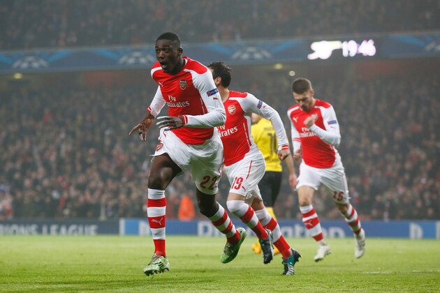 LONDON, ENGLAND - NOVEMBER 26:  Yaya Sanogo of Arsenal celebrates after scoring the opening goal during the UEFA Champions League Group D match between Arsenal and Borussia Dortmund at the Emirates Stadium on November 26, 2014 in London, United Kingdom.  (Photo by Clive Rose/Getty Images)
