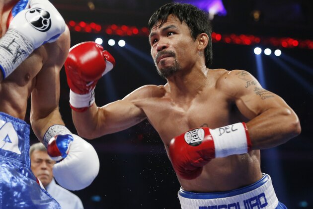 WBO welterweight champion Manny Pacquiao, right, of the Philippines and WBO junior welterweight champion Chris Algieri of the U.S., exchange punches during their world welterweight title boxing match at the Venetian Macao in Macau, Sunday, Nov. 23, 2014. (AP Photo/Kin Cheung) WBO welterweight champion Manny Pacquiao, right, of the Philippines and WBO junior welterweight champion Chris Algieri of the U.S., exchange punches during their world welterweight title boxing match at the Venetian Macao in Macau, Sunday, Nov. 23, 2014. (AP Photo/Kin Cheung)