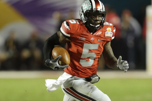 Ohio State quarterback Braxton Miller (5) runs on his way to scoring a touchdown during the first half of the Orange Bowl NCAA college football game, Friday, Jan. 3, 2014, in Miami Gardens, Fla. (AP Photo/Wilfredo Lee)