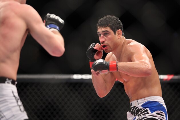 Danny Castillo, right, in action against John Cholish during their bout at UFC on Fox at the Izod Center in E. Rutherford, NJ on Saturday, May 5, 2012.  Castillo won via unanimous decision. (AP Photo/Gregory Payan)