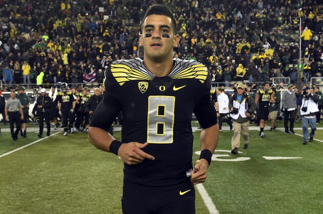 EUGENE, OR - NOVEMBER 1: Quarterback Marcus Mariota #8 of the Oregon Ducks runs out onto the field after the game against the Stanford Cardinal at Autzen Stadium on November 1, 2014 in Eugene, Oregon. Oregon won the game 45-16.(Photo by Steve Dykes/Getty Images)