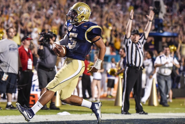 Dec 31, 2014; Miami Gardens, FL, USA; Georgia Tech Yellow Jackets quarterback Justin Thomas (5) scores a touchdown against the Mississippi State Bulldogs in the second half of the Orange Bowl game at Sun Life Stadium. Georgia Tech defeated the Bulldogs 49-34. Mandatory Credit: Brad Barr-USA TODAY Sports Dec 31, 2014; Miami Gardens, FL, USA; Georgia Tech Yellow Jackets quarterback Justin Thomas (5) scores a touchdown against the Mississippi State Bulldogs in the second half of the Orange Bowl game at Sun Life Stadium. Georgia Tech defeated the Bulldogs 49-34. Mandatory Credit: Brad Barr-USA TODAY Sports