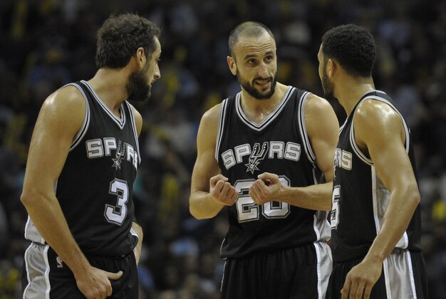Dec 30, 2014; Memphis, TN, USA; San Antonio Spurs guards Marco Belinelli (3) and Manu Ginobili (20) and Cory Joseph (5) talk during the game against the Memphis Grizzlies at FedExForum. Memphis Grizzlies beat the San Antonio Spurs 95 - 87. Mandatory Credit: Justin Ford-USA TODAY Sports