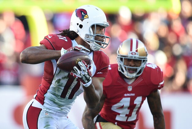 December 28, 2014; Santa Clara, CA, USA; Arizona Cardinals wide receiver Larry Fitzgerald (11) catches a pass against San Francisco 49ers strong safety Antoine Bethea (41) during the second quarter at Levi's Stadium. Mandatory Credit: Kyle Terada-USA TODAY Sports