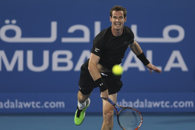 Britain's Andy Murray returns the ball to Feliciano Lopez of Spain during the first day of the Mubadala World Tennis Championship in Abu Dhabi, United Arab Emirates, Thursday, Jan. 1, 2015. (AP Photo/Kamran Jebreili)