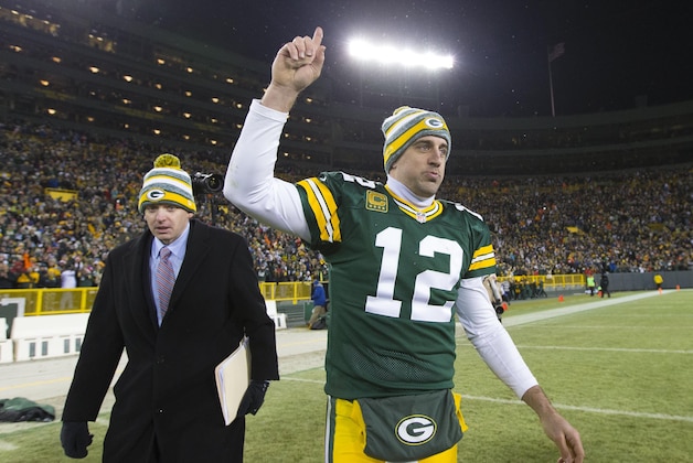 Dec 28, 2014; Green Bay, WI, USA; Green Bay Packers quarterback Aaron Rodgers (12) celebrates following the game against the Detroit Lions at Lambeau Field.  Green Bay won 30-20.  Mandatory Credit: Jeff Hanisch-USA TODAY Sports