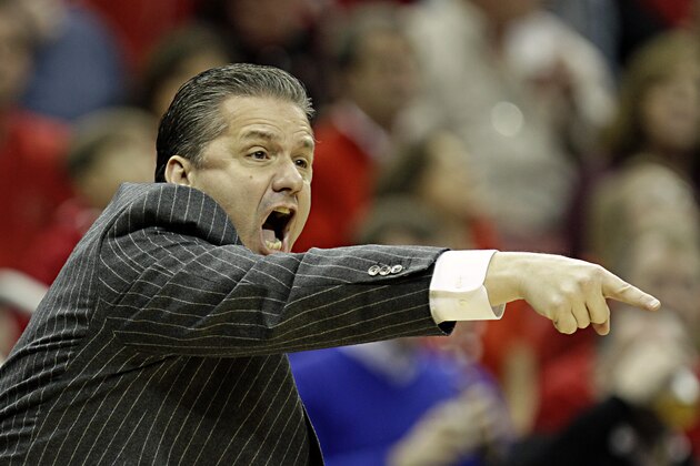 Kentucky coach John Calipari gestures as he directs his top-ranked team against No. 4 Louisville in their NCAA college basketball game in Louisville, Ky., Saturday, Dec. 27, 2014. (AP Photo/Garry Jones)