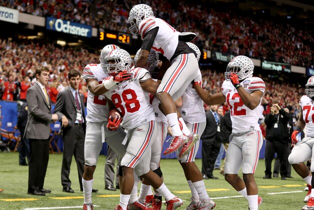 Jan 1, 2015; New Orleans, LA, USA; Ohio State Buckeyes defensive lineman Steve Miller (88) is mobbed by teammates after returning an interception for a touchdown against the Alabama Crimson Tide in the third quarter of the 2015 Sugar Bowl at Mercedes-Benz Superdome. Mandatory Credit: Chuck Cook-USA TODAY Sports