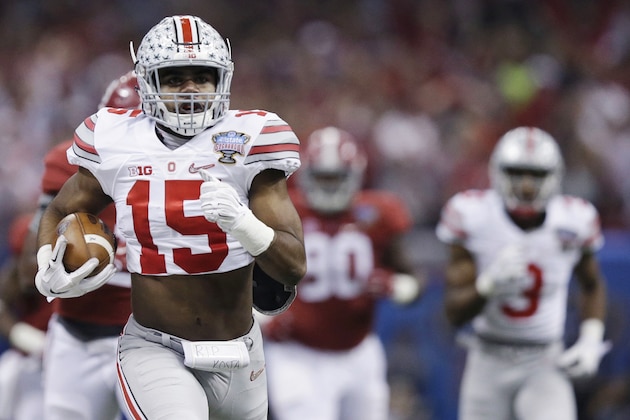 Ohio State running back Ezekiel Elliott (15) runs Alabama in the first half of the Sugar Bowl NCAA college football playoff semifinal game, Thursday, Jan. 1, 2015, in New Orleans. (AP Photo/Brynn Anderson)