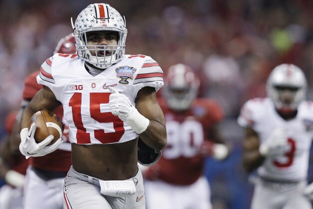 Ohio State running back Ezekiel Elliott (15) runs Alabama in the first half of the Sugar Bowl NCAA college football playoff semifinal game, Thursday, Jan. 1, 2015, in New Orleans. (AP Photo/Brynn Anderson)