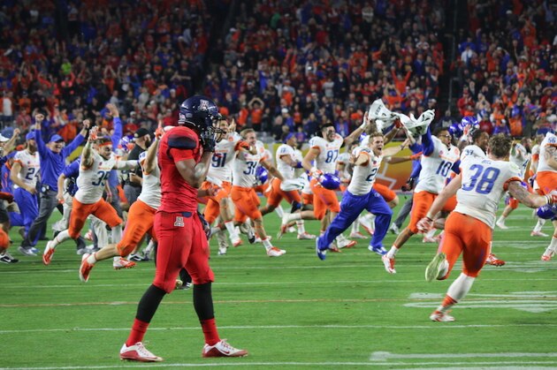 GLENDALE, AZ - DECEMBER 31:  Head coach Bryan Harsin of the Boise State Broncos holds up the Vizio Fiesta Bowl trophy in celebration after defeating the Arizona Wildcats 38-30 at University of Phoenix Stadium on December 31, 2014 in Glendale, Arizona.  (Photo by Christian Petersen/Getty Images)