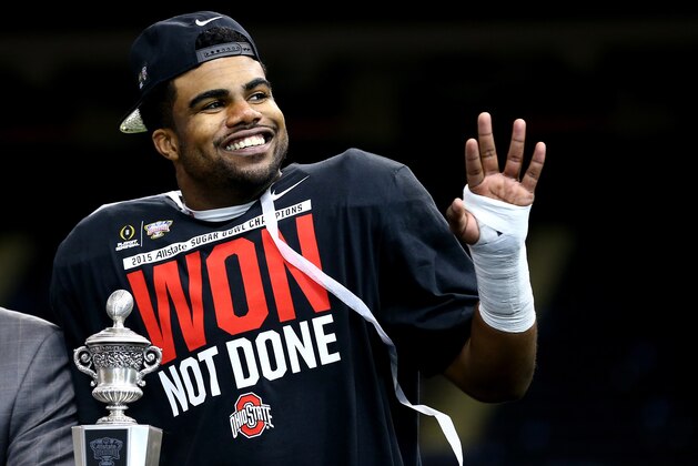 NEW ORLEANS, LA - JANUARY 01:  Ezekiel Elliott #15 of the Ohio State Buckeyes celebrates with the trophy after defeating the Alabama Crimson Tide in the All State Sugar Bowl at the Mercedes-Benz Superdome on January 1, 2015 in New Orleans, Louisiana.  The Ohio State Buckeyes defeated the Alabama Crimson Tide 42 to 35.  (Photo by Streeter Lecka/Getty Images)