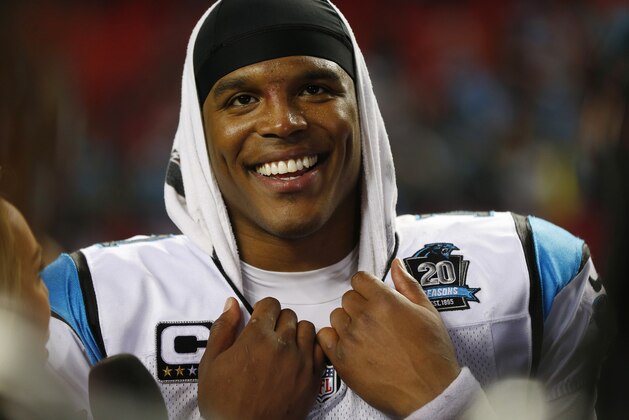 Carolina Panthers quarterback Cam Newton (1) stands on the sidelines during the second half of an NFL football game against the Atlanta Falcons, Sunday, Dec. 28, 2014, in Atlanta. (AP Photo/John Bazemore)