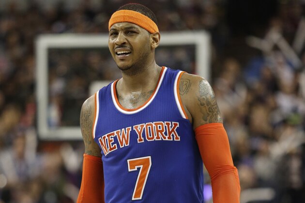New York Knicks forward Carmelo Anthony reacts to a call during the third quarter of an NBA basketball game against the Sacramento Kings in Sacramento, Calif., Saturday, Dec. 27, 2014. (AP Photo/Carl Costas)