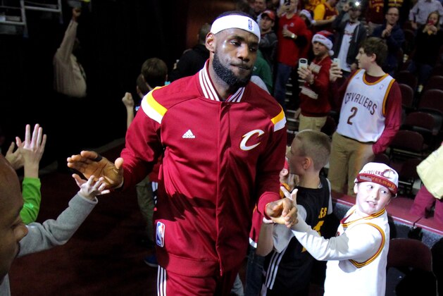 CLEVELAND, OH - DECEMBER 23: LeBron James #23 of the Cleveland Cavaliers takes the court for warm ups before a game against the Minnesota Timberwolves at Quicken Loans Arena on December 23, 2014 in Cleveland, Ohio. NOTE TO USER: User expressly acknowledges and agrees that, by downloading and or using this photograph, User is consenting to the terms and conditions of the Getty Images License Agreement.  (Photo by Mike Lawrie/Getty Images)