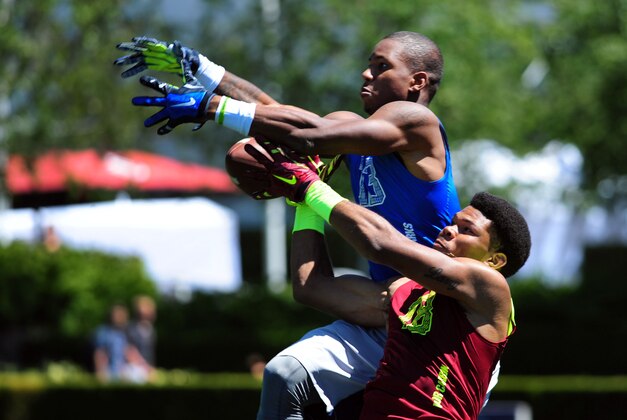 Jul 9, 2014; Beaverton, OR, USA; Vapor Carbon safety Larry Pryor (18)breaks up a pass intended for Land Sharks wide receiver Tyron Johnson (13) during Nike Football ' The Opening' at Nike World Headquarters. Mandatory Credit: Steve Dykes-USA TODAY Sports