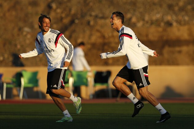 MARRAKECH, MOROCCO - DECEMBER 19: Cristiano Ronaldo of Real Madrid enjoys a joke with Fabio Coentrao during a training session at Le Grande Stade de Marrakech on December 19, 2014 in Marrakech, Morocco.  (Photo by Steve Bardens/Getty Images)