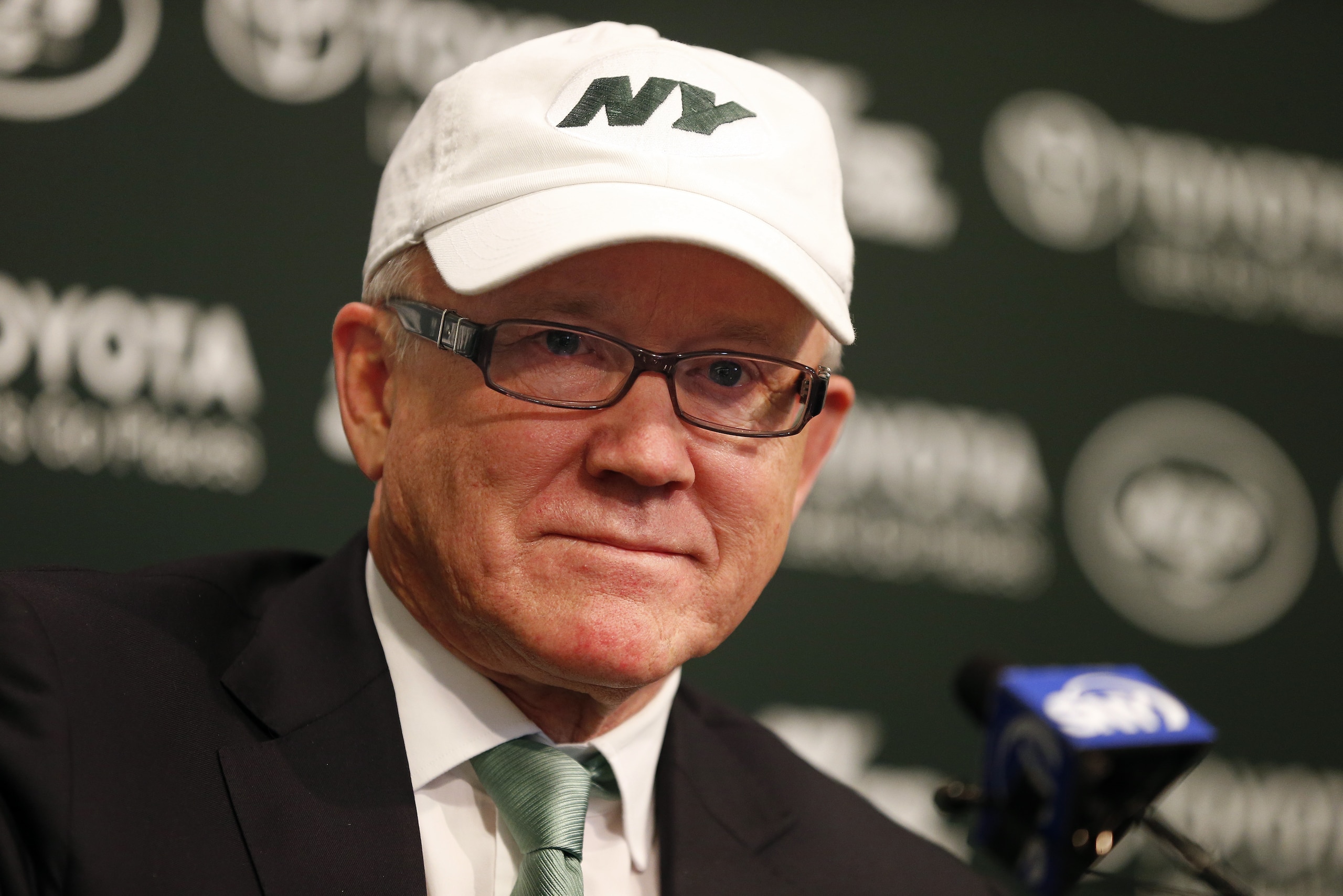 New York Jets owner Woody Johnson announces the firing of head coach Rex Ryan and general manager John Idzik at the team's practice facility in Florham Park, N.J., Monday, Dec. 29, 2014. (AP Photo/Rich Schultz)