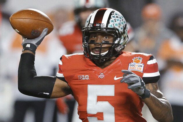FILE -  In this Jan. 3, 2014 file photo, Ohio State quarterback Braxton Miller passes the football during the first half of the Orange Bowl NCAA college football game against Clemson, Friday, Jan. 3, 2014, in Miami Gardens, Fla. Ohio State ended the season with a two game losing streak. (AP Photo/Wilfredo Lee, File)