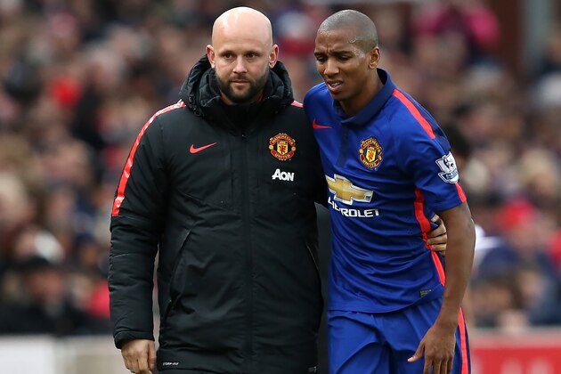 STOKE ON TRENT, ENGLAND - JANUARY 01:  Ashley Young of Manchester United is helped off with an injury during the Barclays Premier League match between Stoke City and Manchester United at Britannia Stadium on January 1, 2015 in Stoke on Trent, England.  (Photo by Jan Kruger/Getty Images)