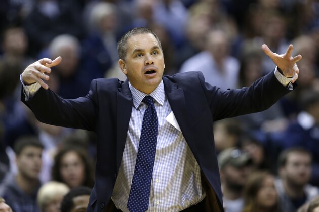 Butler interim head coach Chris Holtmann gestures to his players as they played Indiana in the first half of an NCAA college basketball game in Indianapolis, Saturday, Dec. 20, 2014. (AP Photo/Michael Conroy)
