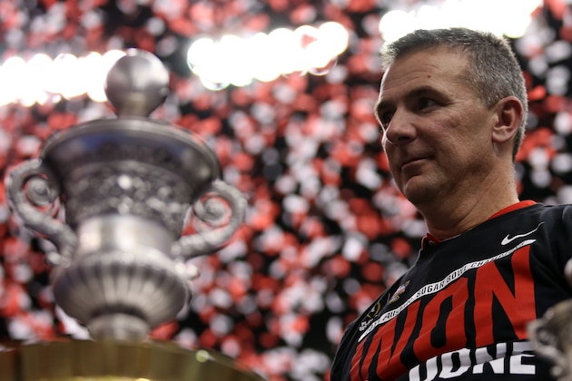 NEW ORLEANS, LA - JANUARY 01:  Head coach Urban Meyer of the Ohio State Buckeyes celebrates with the trophy after defeating the Alabama Crimson Tide in the All State Sugar Bowl at the Mercedes-Benz Superdome on January 1, 2015 in New Orleans, Louisiana.  The Ohio State Buckeyes defeated the Alabama Crimson Tide 42 to 35.  (Photo by Chris Graythen/Getty Images)