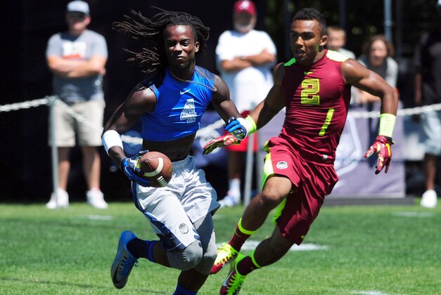 Jul 9, 2014; Beaverton, OR, USA; Land Sharks cornerback Donte Jackson (4) returns an interception as Vapor Carbon wide receiver Christian Kirk (2) gives chase during Nike Football ' The Opening' at Nike World Headquarters. Mandatory Credit: Steve Dykes-USA TODAY Sports