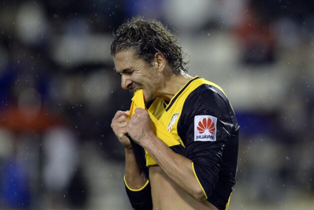 Atletico Madrid's Alessio Cerci, from Italy, reacts during a Copa del Rey soccer match between Atletico Madrid and Hospitalet at the Municipal stadium in Hospitalet Llobregat, Spain, Wednesday, Dec. 3, 2014. (AP Photo/Manu Fernandez)