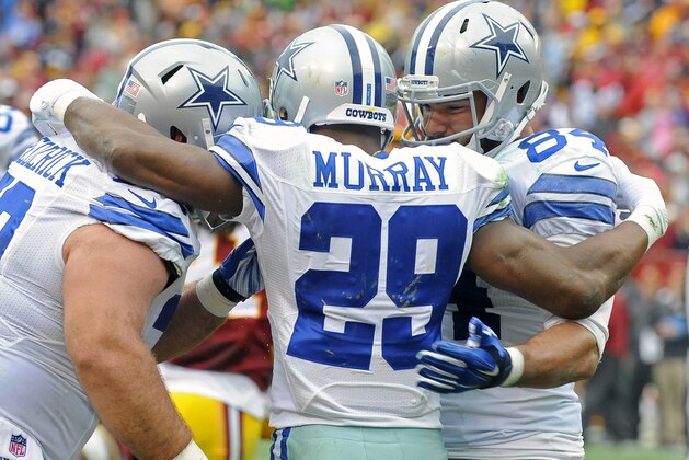Dallas Cowboys running back DeMarco Murray (29) celebrates his touchdown with with teammates during the first half of an NFL football game against the Washington Redskins in Landover, Md., Sunday, Dec. 28, 2014. (AP Photo/Richard Lipski)