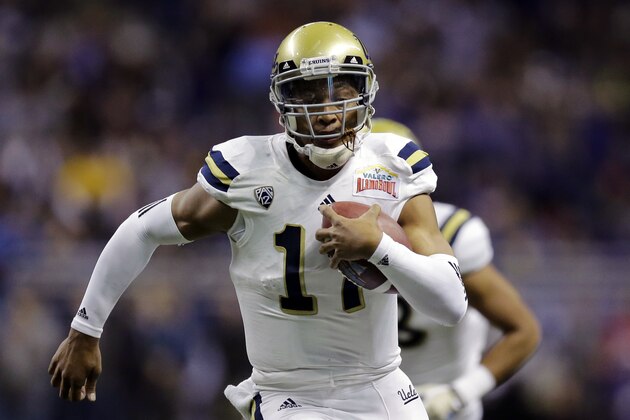 UCLA’s Brett Hundley (17) rushes for a touchdown against Kansas State during the first half of the Alamo Bowl NCAA college football game, Friday, Jan. 2, 2015, in San Antonio. (AP Photo/Eric Gay)