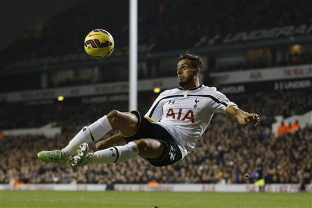 Tottenham's Nacer Chadli tries a shot on goal during the English Premier League soccer match between Tottenham Hotspur and Chelsea at White Hart Lane Stadium in London, Thursday, Jan. 1, 2015. (AP Photo/Kirsty Wigglesworth) Tottenham's Nacer Chadli tries a shot on goal during the English Premier League soccer match between Tottenham Hotspur and Chelsea at White Hart Lane Stadium in London, Thursday, Jan. 1, 2015. (AP Photo/Kirsty Wigglesworth)