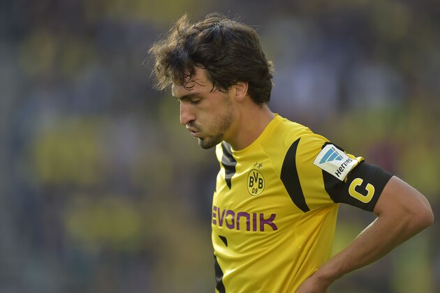 Dortmund's Mats Hummels reacts during the German Bundesliga soccer match between Borussia Dortmund and Hamburger SV in Dortmund, Germany, Saturday, Oct. 4, 2014. Dortmund was defeated by Hamburg with 0-1. (AP Photo/Martin Meissner)