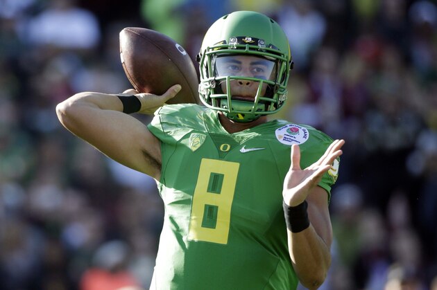 Oregon quarterback Marcus Mariota prepares to throw against Florida State during the first half of the Rose Bowl NCAA college football playoff semifinal, Thursday, Jan. 1, 2015, in Pasadena, Calif. (AP Photo/Jae C. Hong)