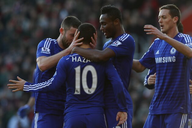 Chelsea’s Eden Hazard is congratulated by his teammates after scoring a goal during the English Premier League soccer match between Southampton and Chelsea at St Mary's Stadium, Southampton, England, Sunday, Dec. 28, 2014. (AP Photo/Tim Ireland)