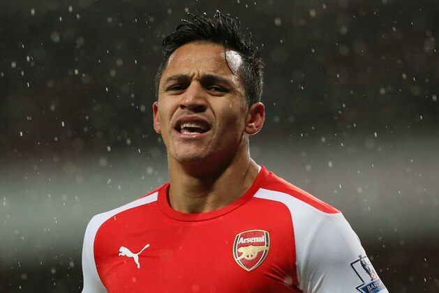 Arsenal’s Alexis Sanchez looks dejected after missing a penalty during the English Premier League soccer match between Arsenal and Queens Park Rangers at the Emirates Stadium, London, Friday, Dec. 26, 2014. (AP Photo/Tim Ireland)