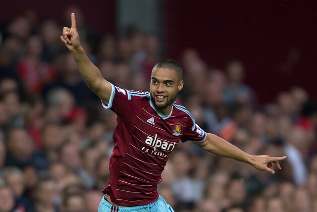 West Ham United’s Winston Reid celebrates scoring his team's first goal during their English Premier League soccer match against Liverpool at Upton Park, London, Saturday, Sept. 20, 2014. (AP Photo/Tim Ireland)
