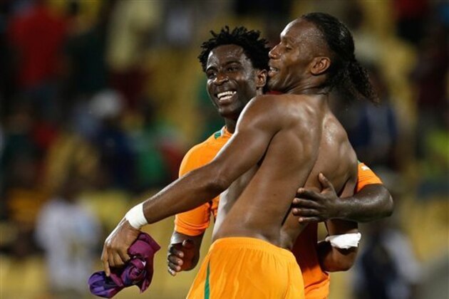 Ivory Coast's Didier Drogba, right, celebrates with teammate Bony Wilfried at the end of their African Cup of Nations group D match with Algeria at the Royal Bafokeng stadium in Rustenburg, South Africa, Wednesday, Jan. 30, 2013. The two scored one goal each in the game that ended in a 2-2 draw. The two other teams in group D are Tunisia and Togo. (AP Photo/Armando Franca)