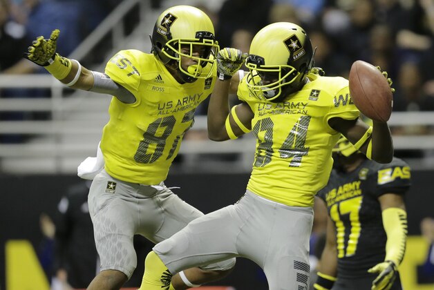 U.S. Army All-American West's Ykili Ross (87) and Derrick Dillon (84) celebrates after Dillon scored on a 30-yard touchdown during the first half of the U.S. Army All-American Bowl high school football game, Saturday, Jan. 3, 2015, in San Antonio. (AP Photo/Eric Gay)