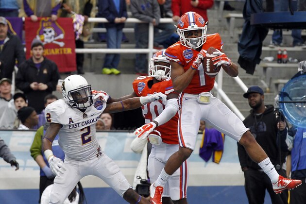 Florida defensive back Vernon Hargreaves (1) intercepts a pass in the end zone intended for East Carolina wide receiver Justin Hardy (2) to secure the Gators' 28-20 win late in the fourth quarter of the Birmingham Bowl  NCAA college  football game Saturday, Jan. 3, 2015, in Birmingham, Ala. (AP Photo/Butch Dill)