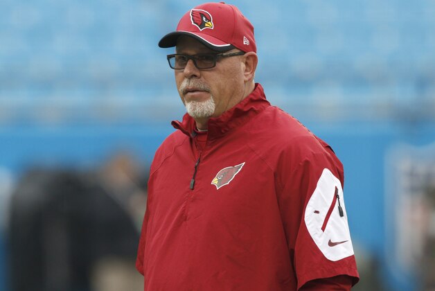 Arizona Cardinals head coach Bruce Arians looks out on the field before an NFL wild card playoff football game against the Carolina Panthers in Charlotte, N.C., Saturday, Jan. 3, 2015. (AP Photo/Bob Leverone)