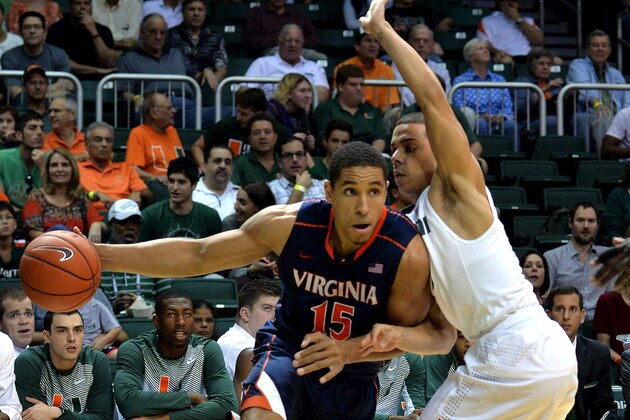 Jan 3, 2015; Coral Gables, FL, USA; Virginia Cavaliers guard Malcolm Brogdon (15) drives to the basket as Miami Hurricanes guard Angel Rodriguez (13) defends during the first half at BankUnited Center. Mandatory Credit: Steve Mitchell-USA TODAY Sports