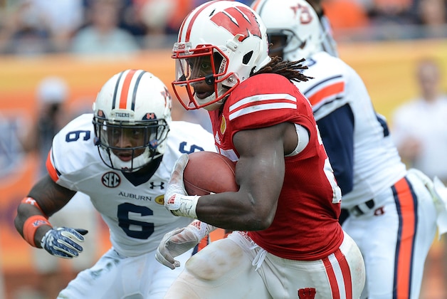Jan 1, 2015; Tampa, FL, USA; Wisconsin Badgers running back Melvin Gordon (25) runs for a touchdown in the second half against the Auburn Tigers in the 2015 Outback Bowl at Raymond James Stadium. The Badgers defeated the Tigers 34-31 in overtime. Mandatory Credit: Jonathan Dyer-USA TODAY Sports