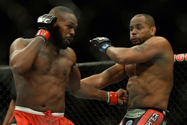 Jan 3, 2015; Las Vegas, NV, USA; Jon Jones (red gloves) and Daniel Cormier (blue gloves) compete in the light heavyweight title fight at UFC 182 at MGM Grand Garden Arena. Mandatory Credit: Jayne Kamin-Oncea-USA TODAY Sports