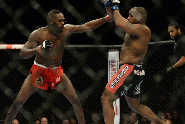 Jan 3, 2015; Las Vegas, NV, USA; Jon Jones (red gloves) and Daniel Cormier (blue gloves) compete in the light heavyweight title fight at UFC 182 at MGM Grand Garden Arena. Mandatory Credit: Jayne Kamin-Oncea-USA TODAY Sports