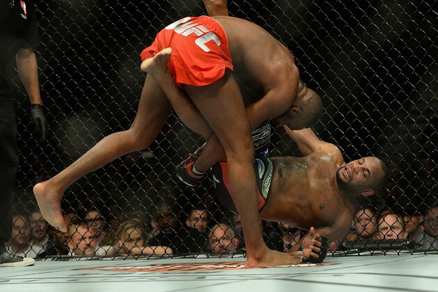 Jan 3, 2015; Las Vegas, NV, USA; Jon Jones (red gloves) and Daniel Cormier (blue gloves) compete during their light heavyweight title fight at UFC 182 at the MGM Grand Garden Arena. Jones won. Mandatory Credit: Jayne Kamin-Oncea-USA TODAY Sports