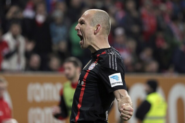 Bayern's Arjen Robben from the Netherlands celebrates after scoring his side's second goal during the German first division Bundesliga soccer match between FC Augsburg and FC Bayern Munich in the SGL Arena in Augsburg, Germany, on Saturday, Dec. 13, 2014. (AP Photo/Matthias Schrader)