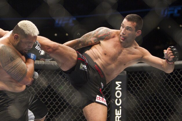 New Zealand's Mark Hunt, left,  battles against Brazil's Fabricio Werdum from during a UFC 180 interim Heavyweight title fight in Mexico City, Saturday, Nov. 15, 2014. Werdum won the fight by KO/TKO. (AP Photo/Christian Palma)