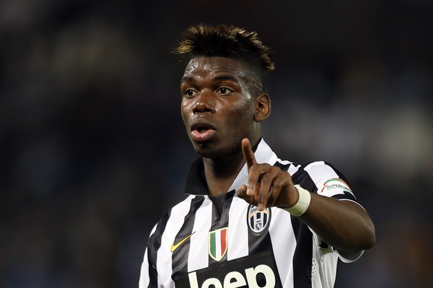 Juventus midfielder Paul Pogba gestures during the Italian Super Cup final match Napoli against Juventus in Doha, Qatar, Monday Dec. 22, 2014. (AP Photo/Osama Faisal)